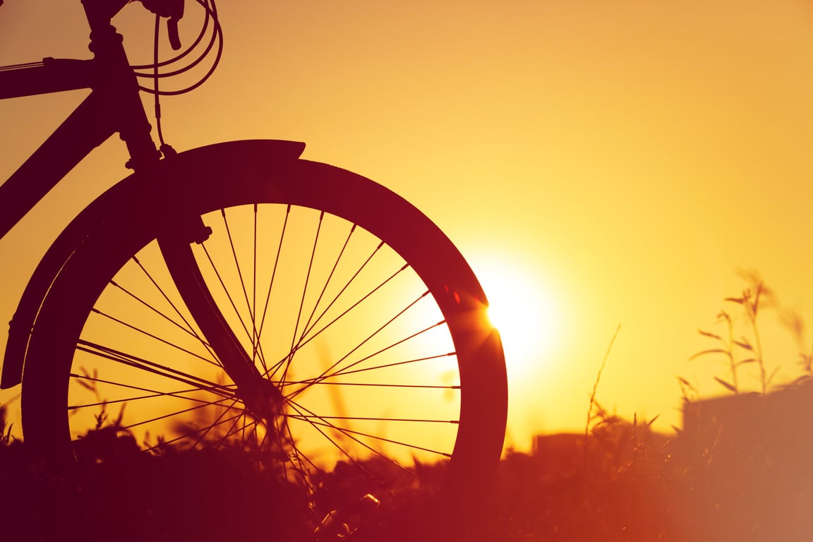 riding bike at sunset nature