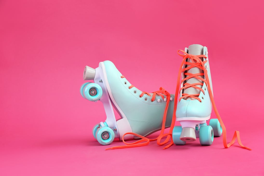 Vintage Roller Skates on Color Background